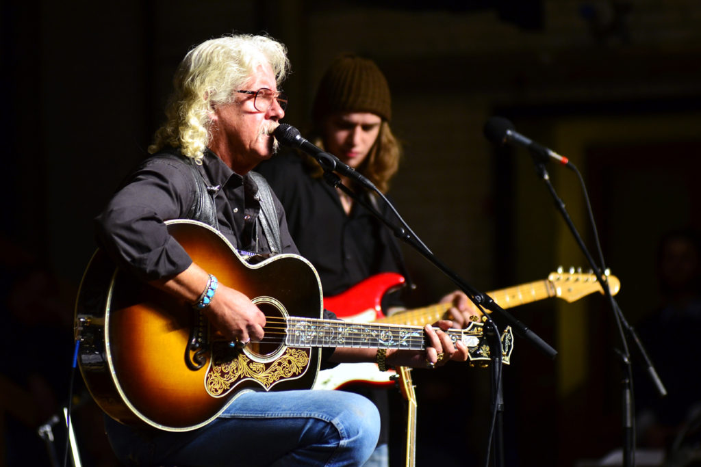 Arlo Guthrie performing on Mountain Stage Radio Show with his acoustic guitar