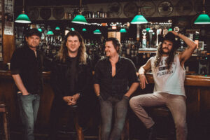 group of men sit at a bar